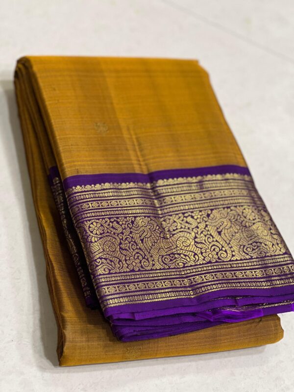 Mustard Yellow Kanjivaram saree with Purple Border