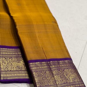 Mustard Yellow Kanjivaram saree with Purple Border