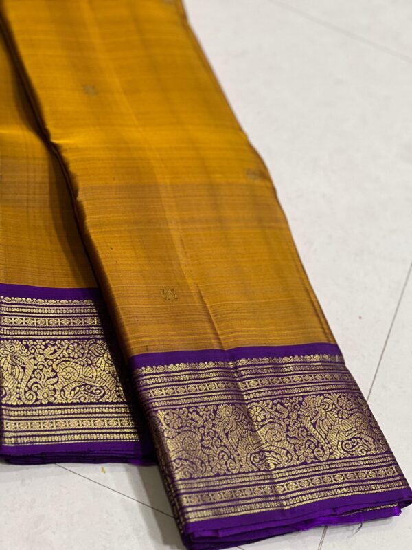 Mustard Yellow Kanjivaram saree with Purple Border