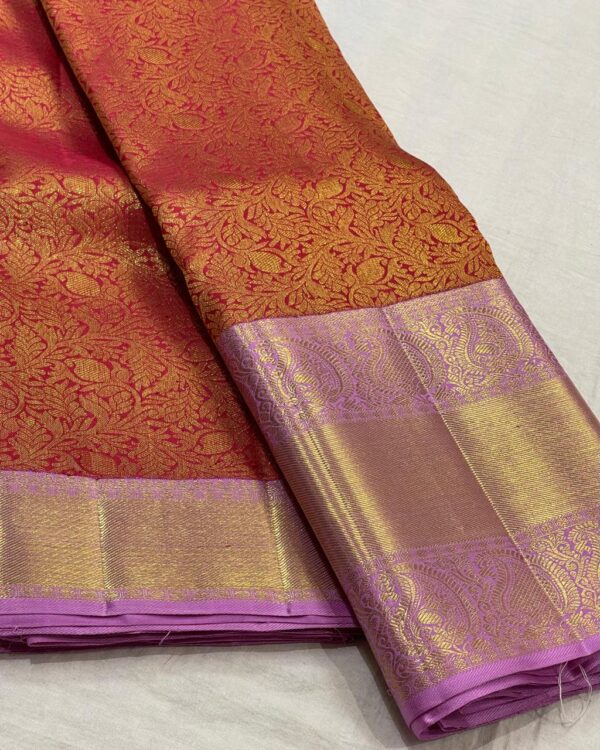 Orange Kanjivaram saree With Pastel Pink Border