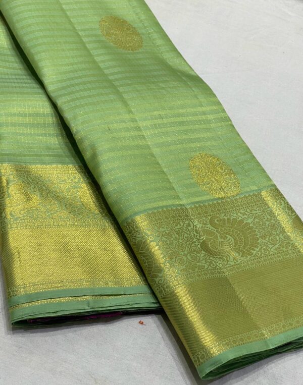 Kanjivaram Silk Saree in Pista Green with Purple Pallu and Blouse