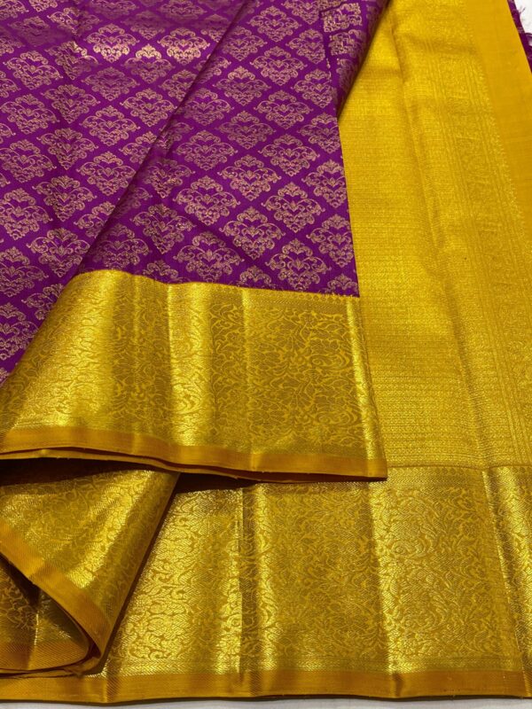 Kanjivaram silk saree in purple body color with mango yellow