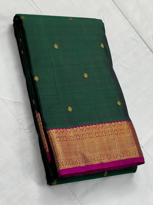 Green Kanchipuram Silk saree With Dark PInk Border