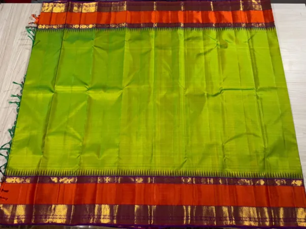 Parrot Green Kanchipuram Silk Saree With Orange Border & Purple Pallu