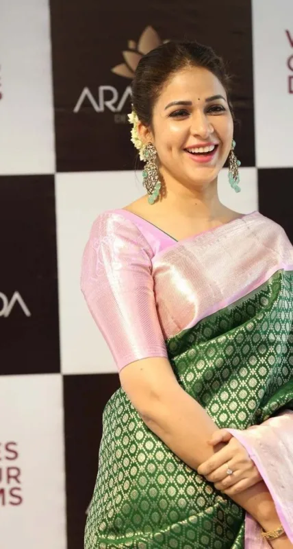 Lavanya Tripathi in Kanjivaram Silk Saree: A Graceful Blend of Green Grandeur and Pastel Pink Elegance 5 download 1